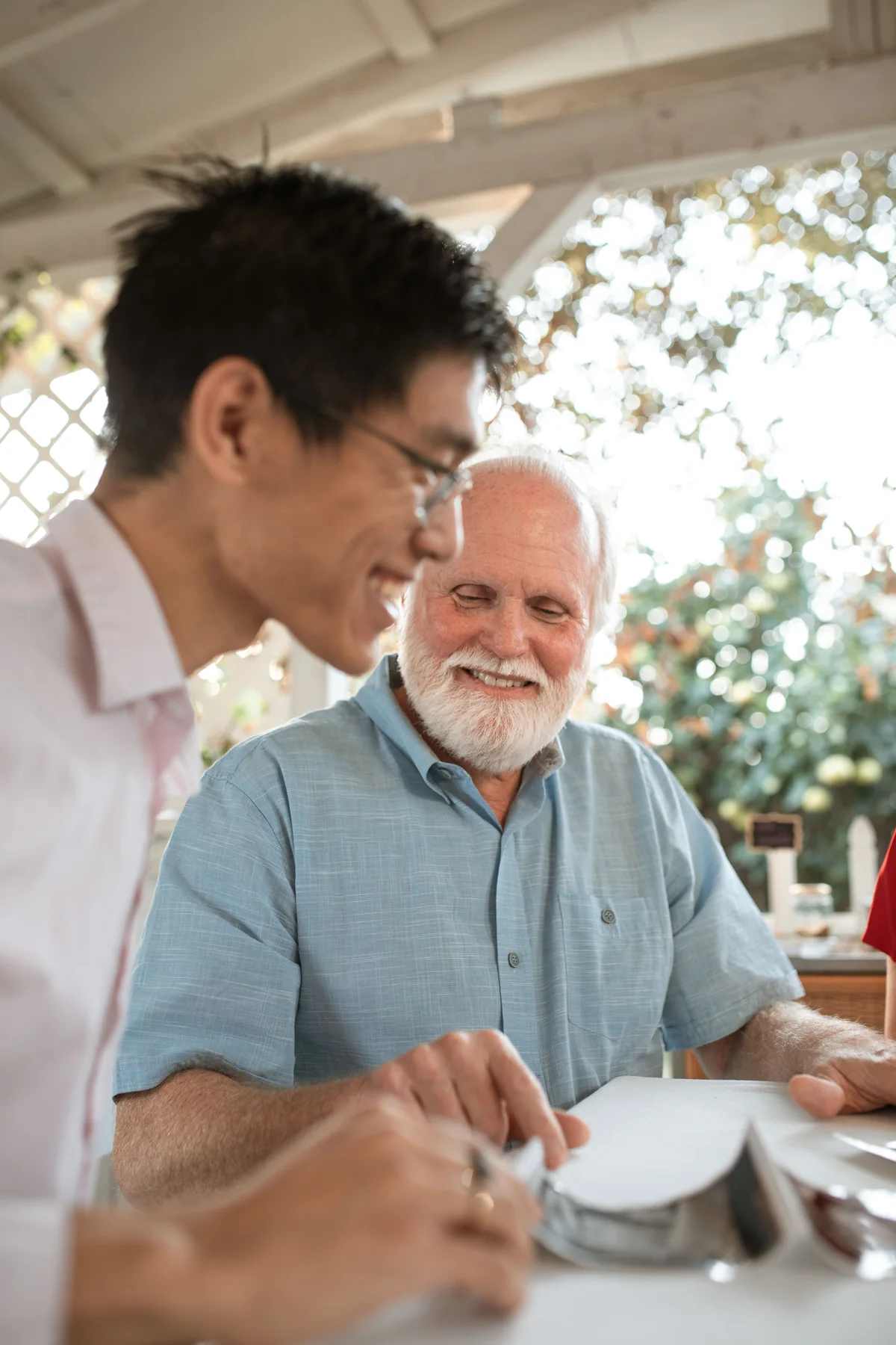 Two adults talking together at a table